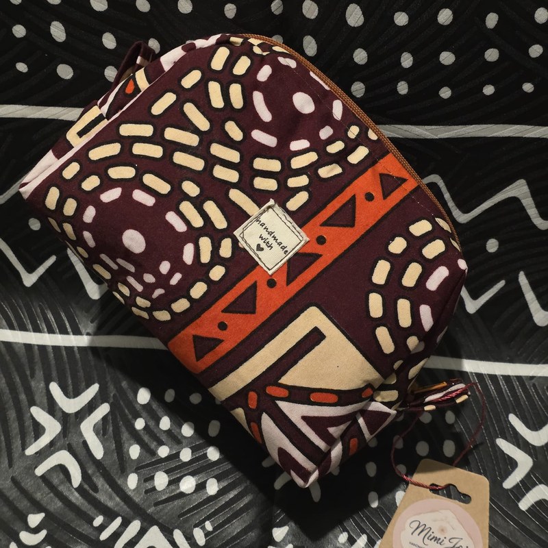 Handmade beauty bag, burgundy and orange print, with Mimi Joi tag