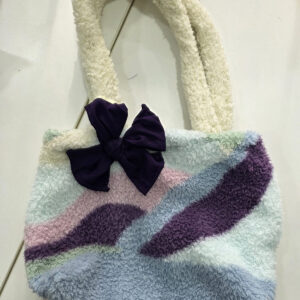 ACAP Made fluffy handmade repurposed bag in lilac, purple, blue, pink and mint with cream fluffy handles and a purple bow