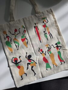 ACAP Made cream tote bag stencilled with dancing figures in red, green, gold and black